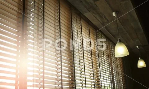 Blinds in a home catching the sunlight with burst light Stock Photos
