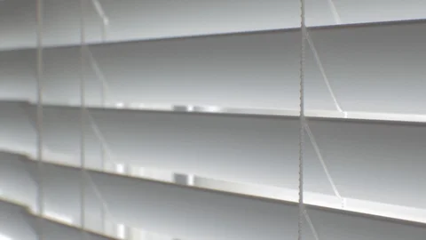 Blinds on a window being opened and closed Stock Footage 88488063