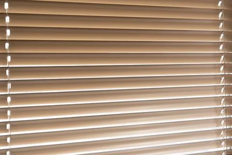 Blinds on the window. Light passing through the blinds Stock Photos