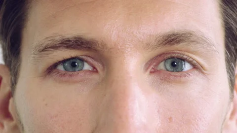 Blink, vision and face with closeup of eyes for retina health, optometry and Video stock 336686592
