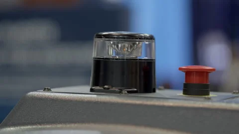 Blinking accident light and red emergency stop button at automated production Stock Footage 346609571