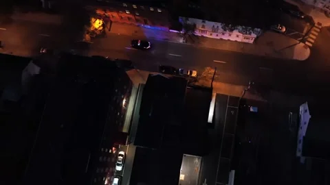 Blinking blue and red lights of police car driving on street at night. Orange Video stock 296325137