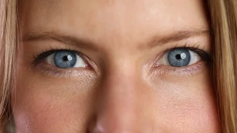 Blinking blue eyes Stock Footage 83431137