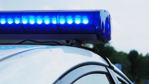 Blinking blue flashing lights during the day. Police patrol car Stock Footage 116911405