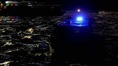 Blinking blue lights of police ship on Martapura river Stock Footage 136240341