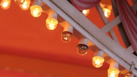 Blinking carousel lights on in an amusement park merry-go-round Stock Footage 90915301