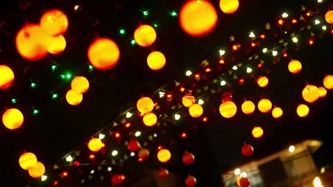 Blinking christmas lights hanging at night Stock Footage 340932702