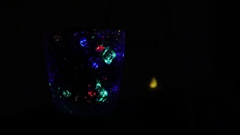 Blinking Christmas tree lights on dark blurred background BDA Stock Footage 128764822