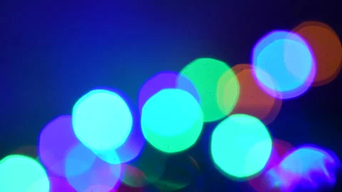 Blinking colored Christmas lights on with green fir branch. Stock Footage 131151563