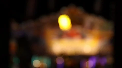 Blinking defocused lights at carnival fun fair at night Stock Footage 119767138