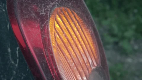 Blinking dusty car indicator lights Stock Footage 157327604