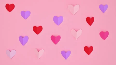 Blinking hearts on Valentine's day background on pastel pink theme. Stop motion. Stock-Footage 229758927
