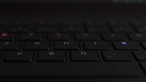 Blinking of the illuminated keyboard buttons letters in multiple RGB colors Stock Footage 122653579