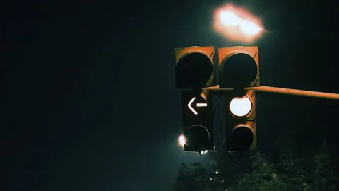 Blinking Left-Turn Traffic Light in Foggy Buenos Aires Night - 4K Stock Footage 293330491