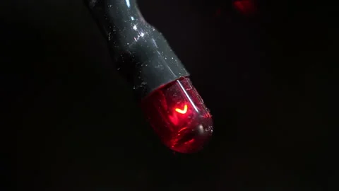 Blinking light bulb from a Christmas tree garland enlarged close-up Stock Footage 144020573
