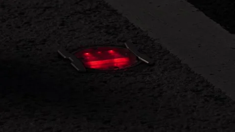 The blinking light sign installed on the road surface of Kyoto, Japan Stock Footage 239909994