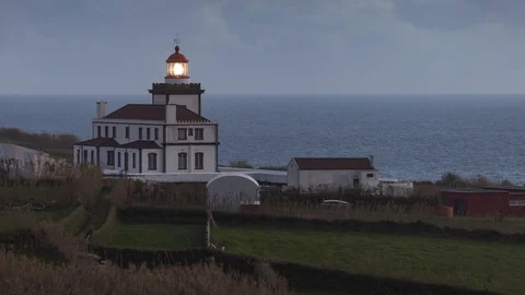 Blinking Lighthouse Somewhere in the Atlantic ocean on Azores islands Stock Footage 99989219