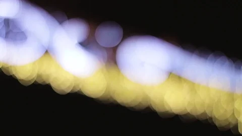 Blinking lights in bokeh at night. Video stock 76736147