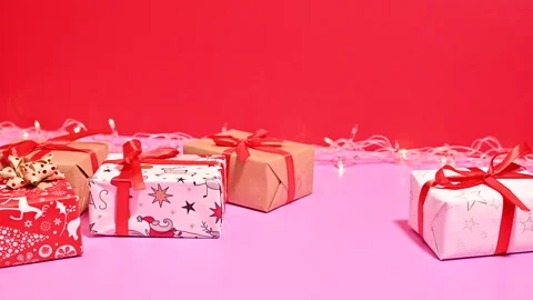 Blinking Lights Illuminate Christmas Background Adorned with Gifts. Stop motion Stock Footage 255389128