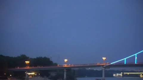 Blinking lights on night bridge, sparkle in water reflection Stock Footage 93698286