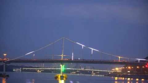 Blinking lights on night bridge, sparkle in water reflection Stock Footage 93698541