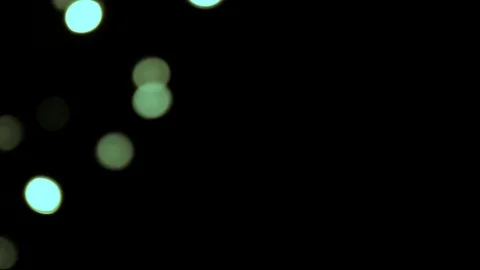 Blinking lights passing blinking on a black background. Out of focus. Stock Footage 99874497