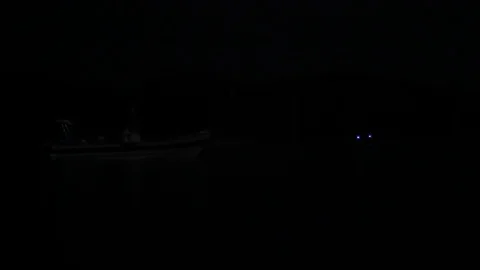 Blinking lights on the sea at night. Video stock 115732894
