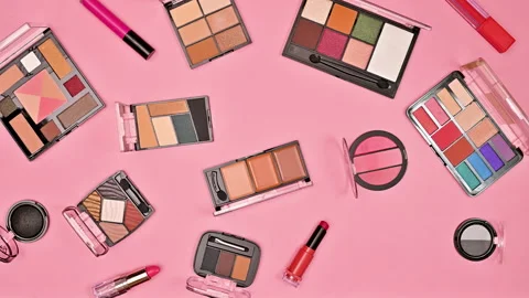 Blinking make up cosmetics pattern on pastel pink background. Stop motion Stock Footage 229499043