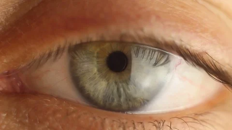 Blinking male eye close-up looking around. red artery on the eyeball macro Stock Footage 108481837