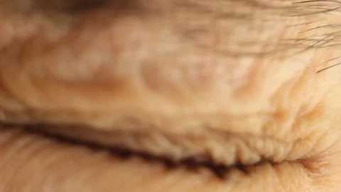 Blinking male eye close-up looking around. red artery on the eyeball macro Stock Footage 108481961