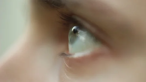 Blinking male eye close up. pensive sad look up macro. Half face of a man on a Stock Footage 106989929