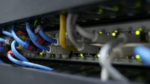 Blinking network ethernet active switch with connected cables in server room. Stock Footage 113614039