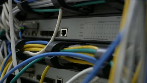 Blinking network ethernet active switch with connected cables in server room. Video stock 113614218