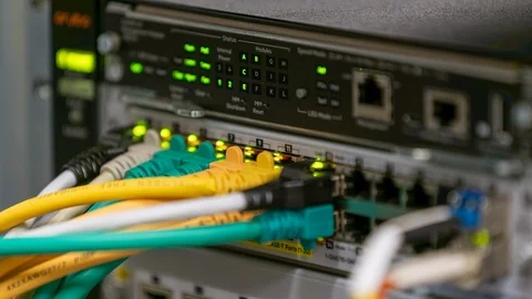 Blinking network  switch with different connected cables in server room Stock Footage 122055600