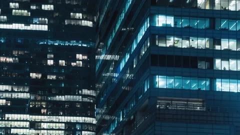 Blinking office windows lights in business center, people working late night Video stock 165476708