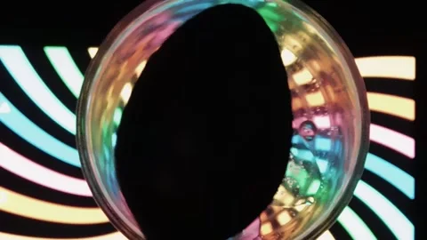 Blinking oil mixed water under back light Stock Footage 138085641