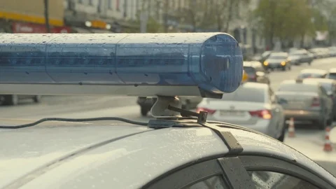 Blinking police flasher On the roof of the car. Close-up Stock Footage