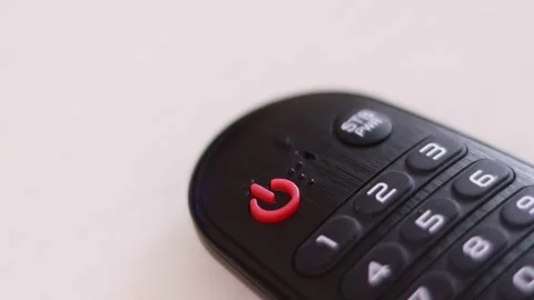 Blinking power button on the remote control. Stock Footage 149841931