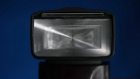 Blinking Professional Camera Flash Unit Closeup Stock Footage 131107686