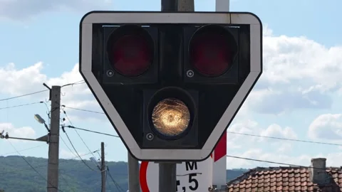 Blinking railway signal light warning approaching train Stock Footage 345927008