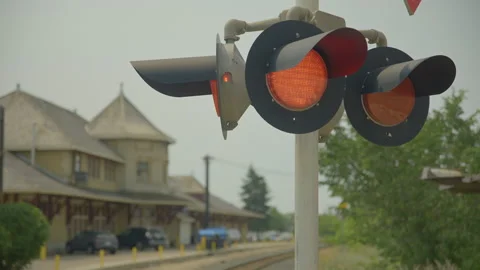Blinking red train lights on a sunny day Stock Footage 211878872
