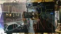 Blinking Tattoo & Piercing led sign close up with reflection of city buildings 4k or 4k+ Resolution