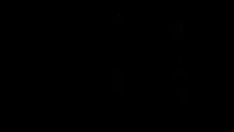 Blinking traffic light at night Stock Footage 84989444