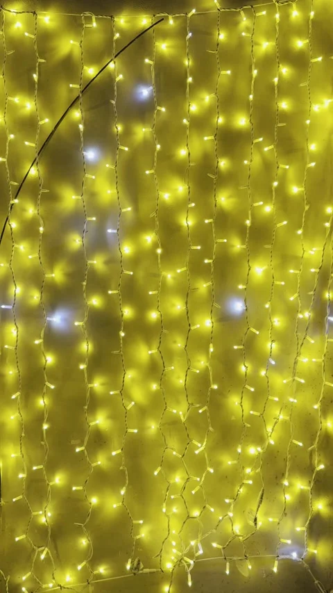 Blinking Warm Fairy Lights Background with Festive Golden Illumination Stock Footage 340353633
