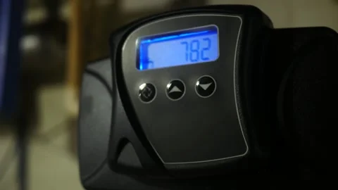 A Blinking Water Filtration System Screen in Residential Basement - Handheld Stock Footage 332576127