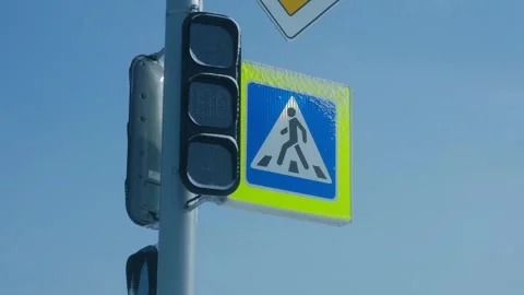 Blinking yellow traffic light at pedestrian crosswalk Stock Footage 337891382