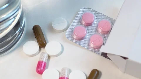 Blister and various tablets close-up on a white background Stock Footage 197346922