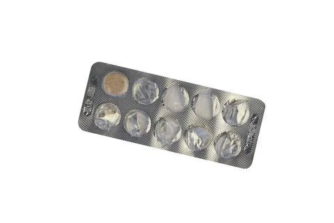 Blister with bright pills isolated on white, top view Stock Photos