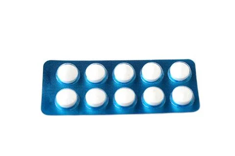 Blister pack of white round tablets isolated on white background. Concept of med Stock Photos
