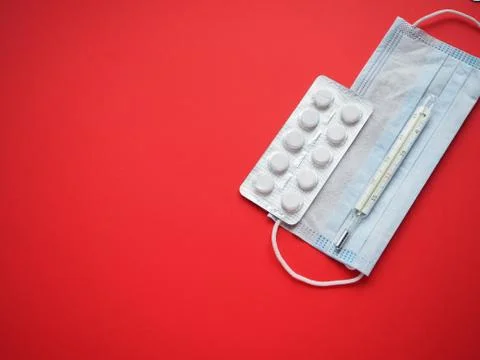 Blister packing tablets with a thermometer Stock Photos